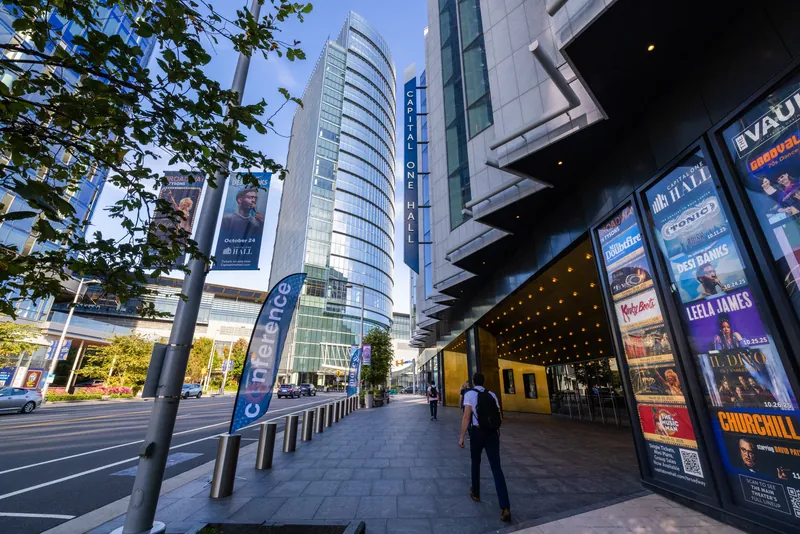 The MOVE Conference flag outside the venue, with the glass towers of Tysons behind it